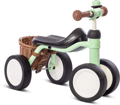 PUKY Babycykel - 1 år - Pukylino Bundle har en mintgrön och svart fyrhjulsdesign med vita däck, en söt flätad korg bak och brun säkerhetshandtag på styret för ökad komfort och säkerhet.