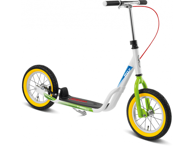 PUKY Sparkcykel - 4,5+ år - Lufthjul - Puky R 07 L är en vit och grön sparkcykel med luftdäck, en stadig ram, svarta däck med gula fälgar och en svart fotbräda. Den har ett böjt styre med svarta handtag och har en röd bromskabel som går från styret till framhjulet.